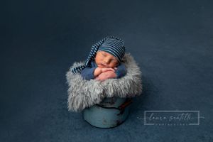 newborn portrait session in bucket prop, newborn blue bonnet, newborn boy photograph