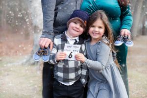 maternity session with family, twin pregnancy announcement, big siblings and twins, outdoor maternity