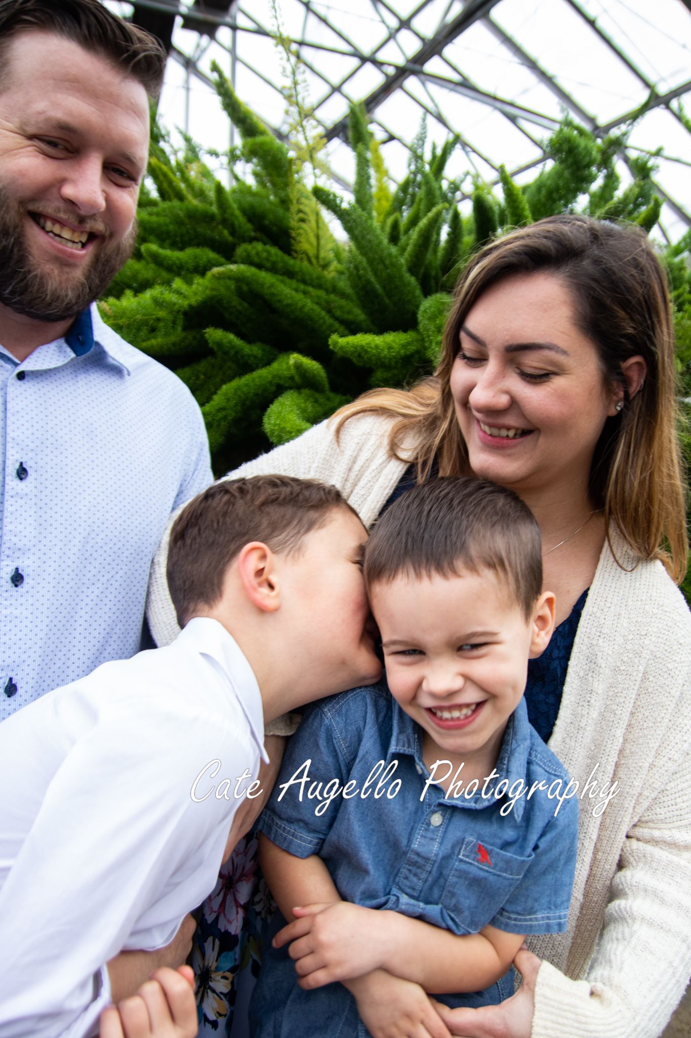 Family photo session in greenhouse in Hartford, CT