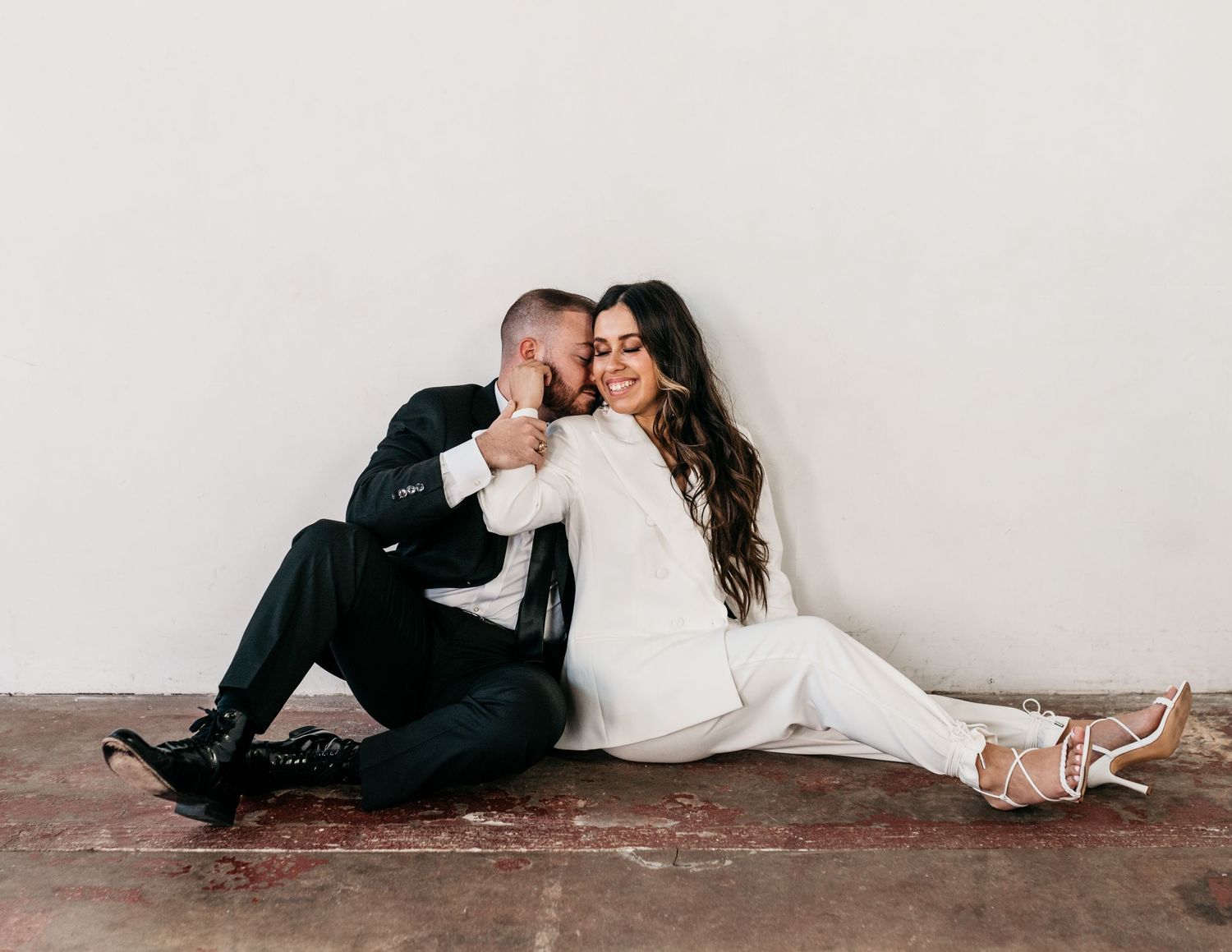Engaged man and woman in Houston photography studio.