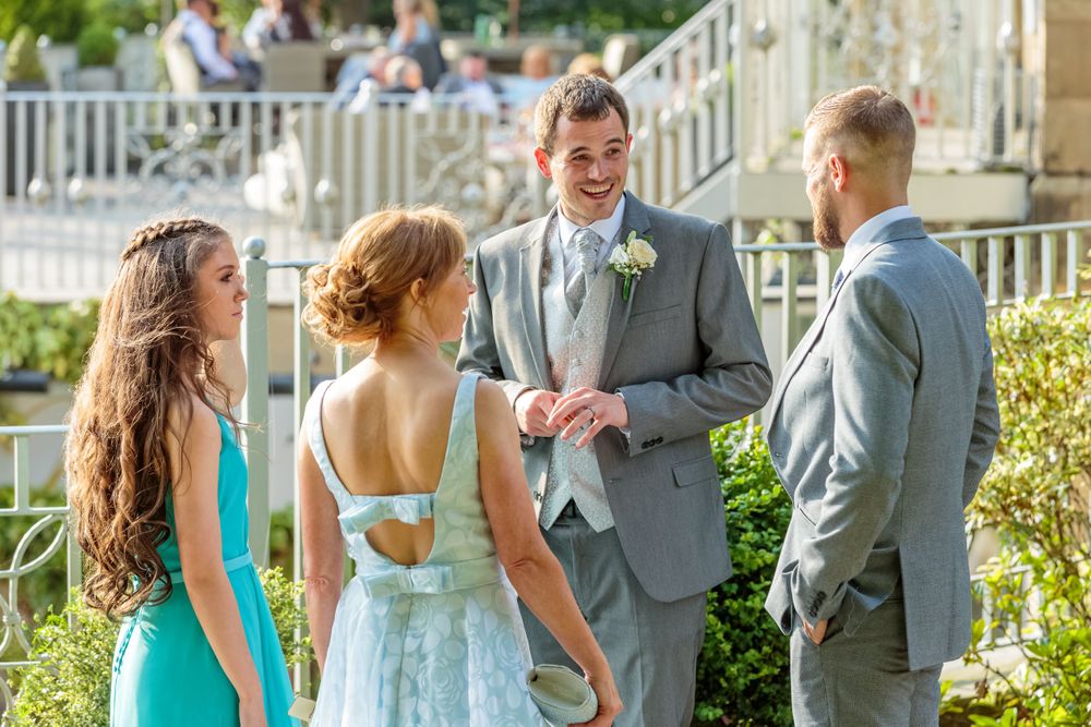 groom laughing an joking with wedding guests at west tower ormskirk
