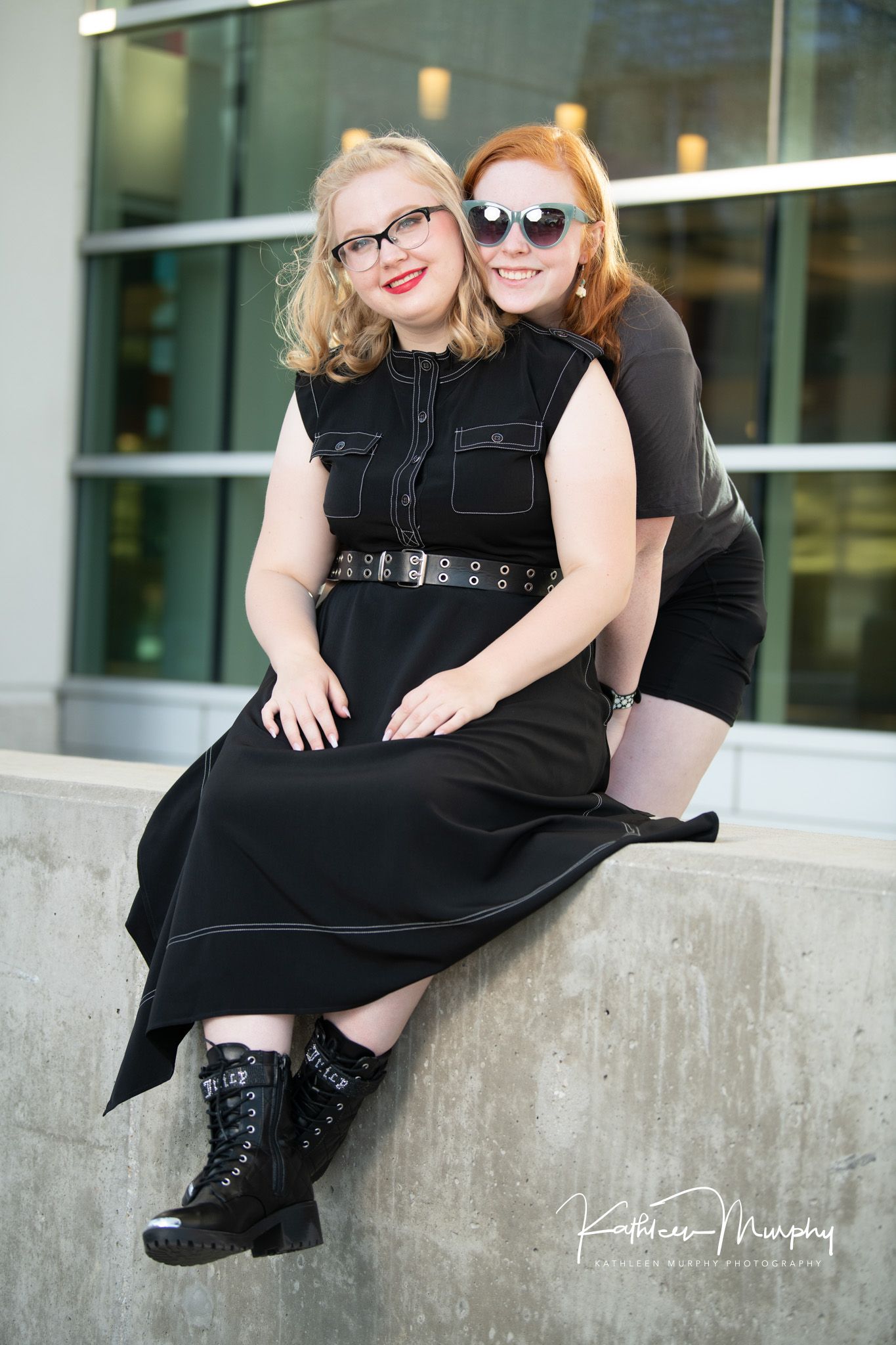 Two sisters pose for a picture.