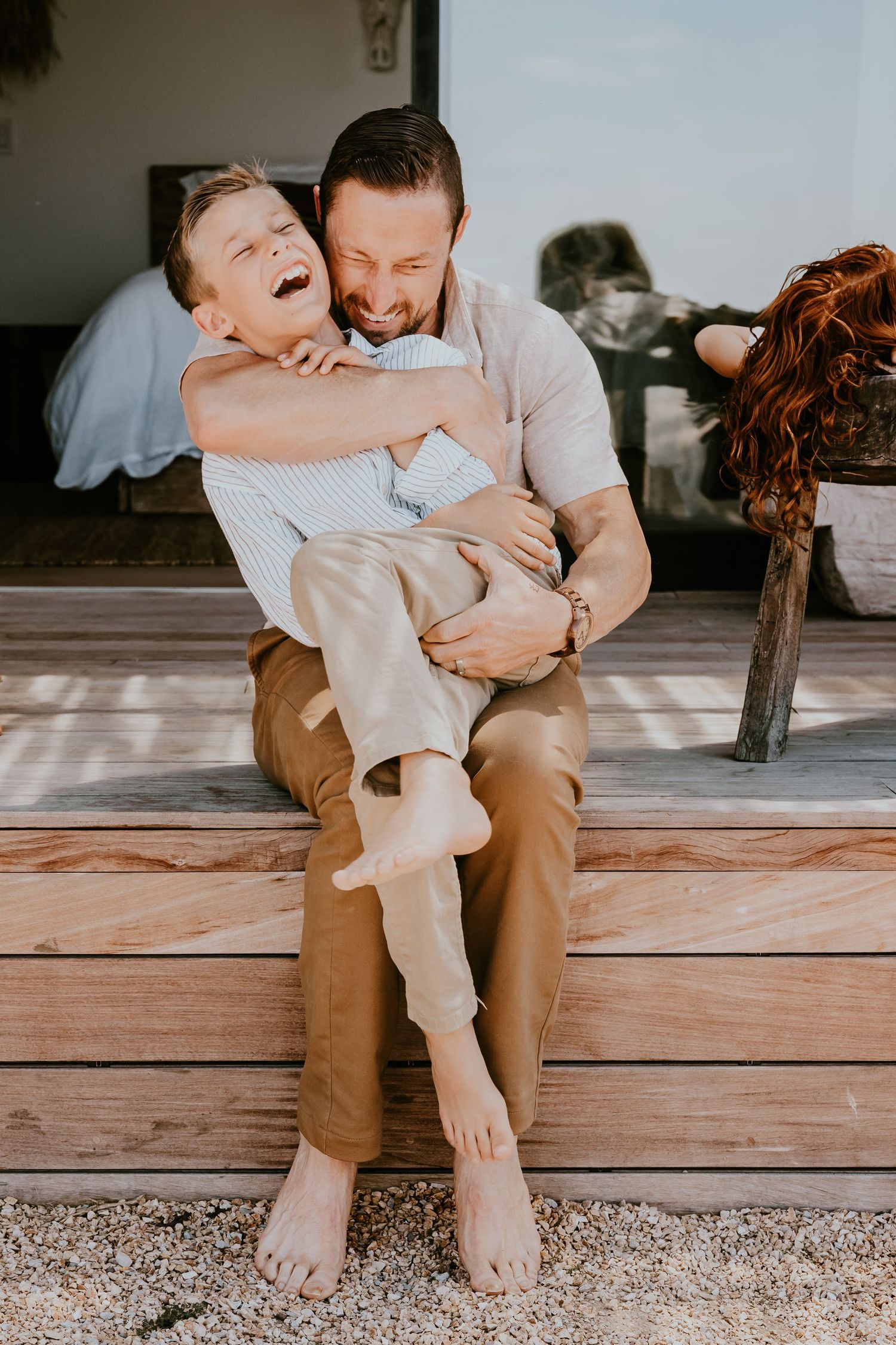 father and son, hug, laughing, outdoors. daddy and me session, family photographer, orange county photographer