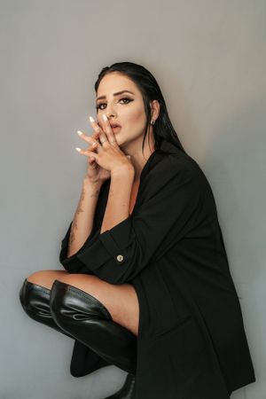 Dramatic fashion portraits showcasing expressive poses in black attire.