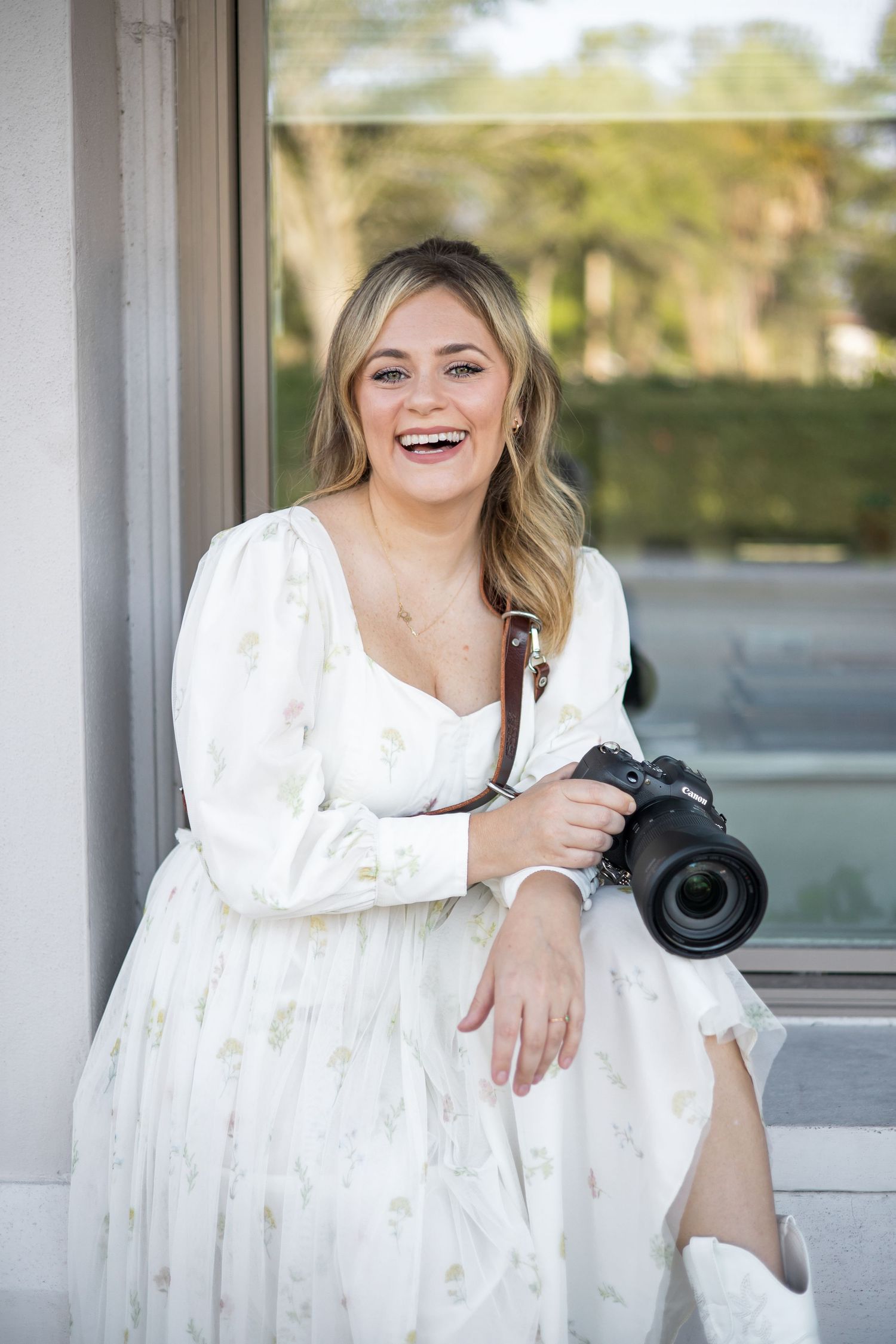Sarasota wedding photographer sitting with camera Downtown Sarasota.