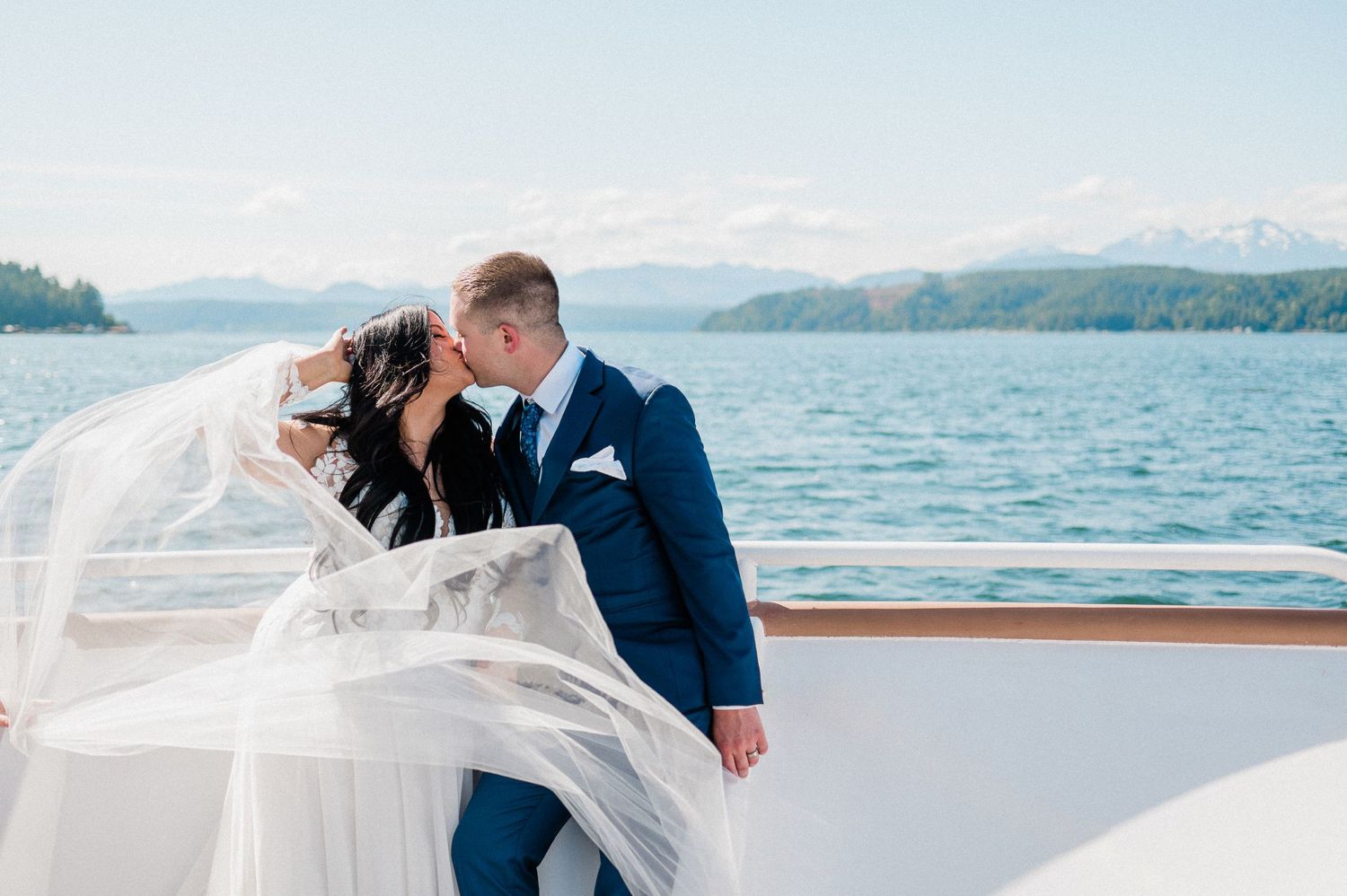Bride and groom on Lady Alderbrook Yacht. Photo by Bremerton wedding photographer, Pine + Vow.