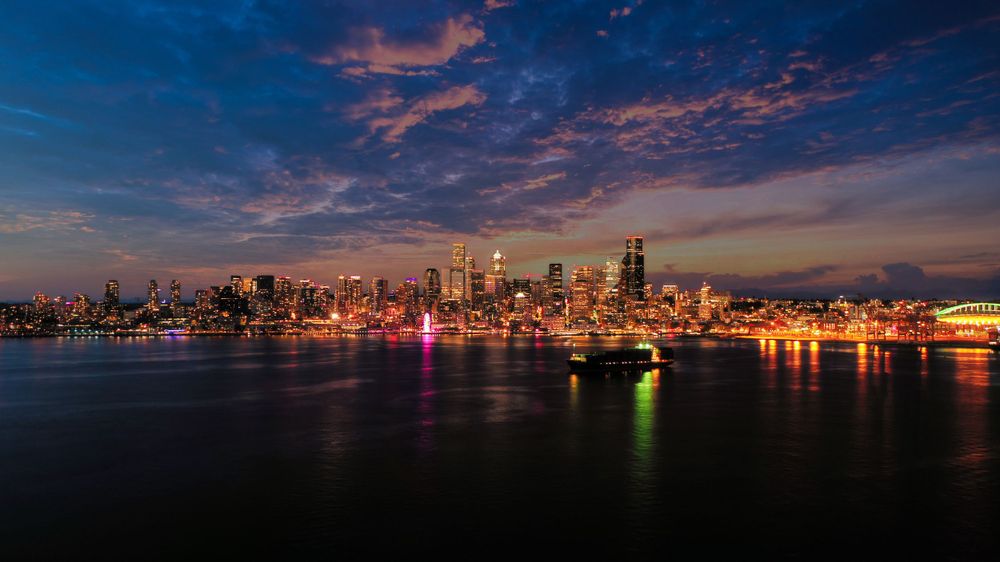 Sunset, dusk drone photo of vibrant Seattle city