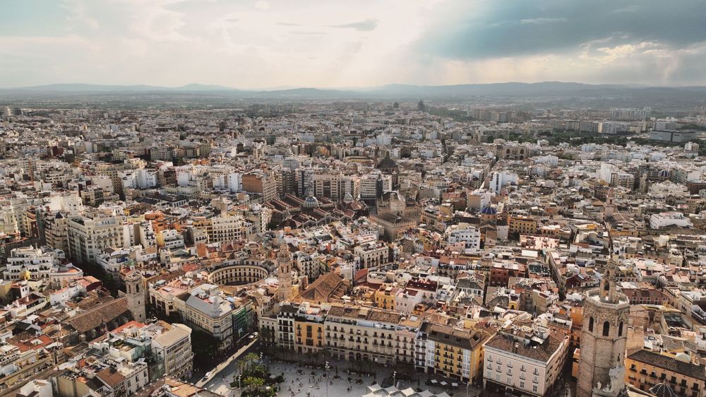 Drone shot of Valencia’s Old Town with historic buildings and sunlit streets