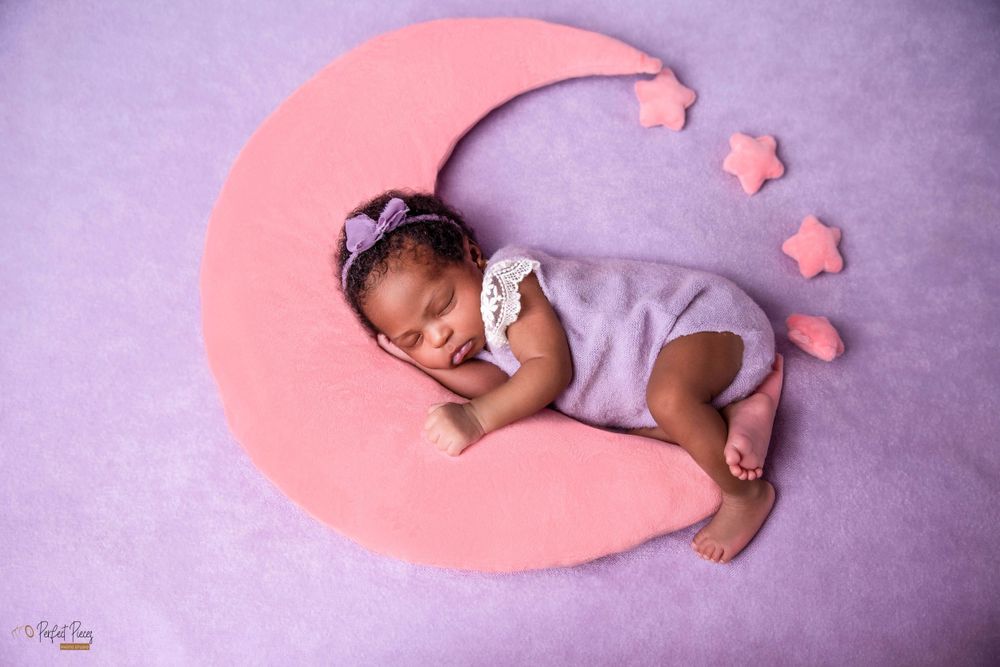 baby on moon newborn photoshoot