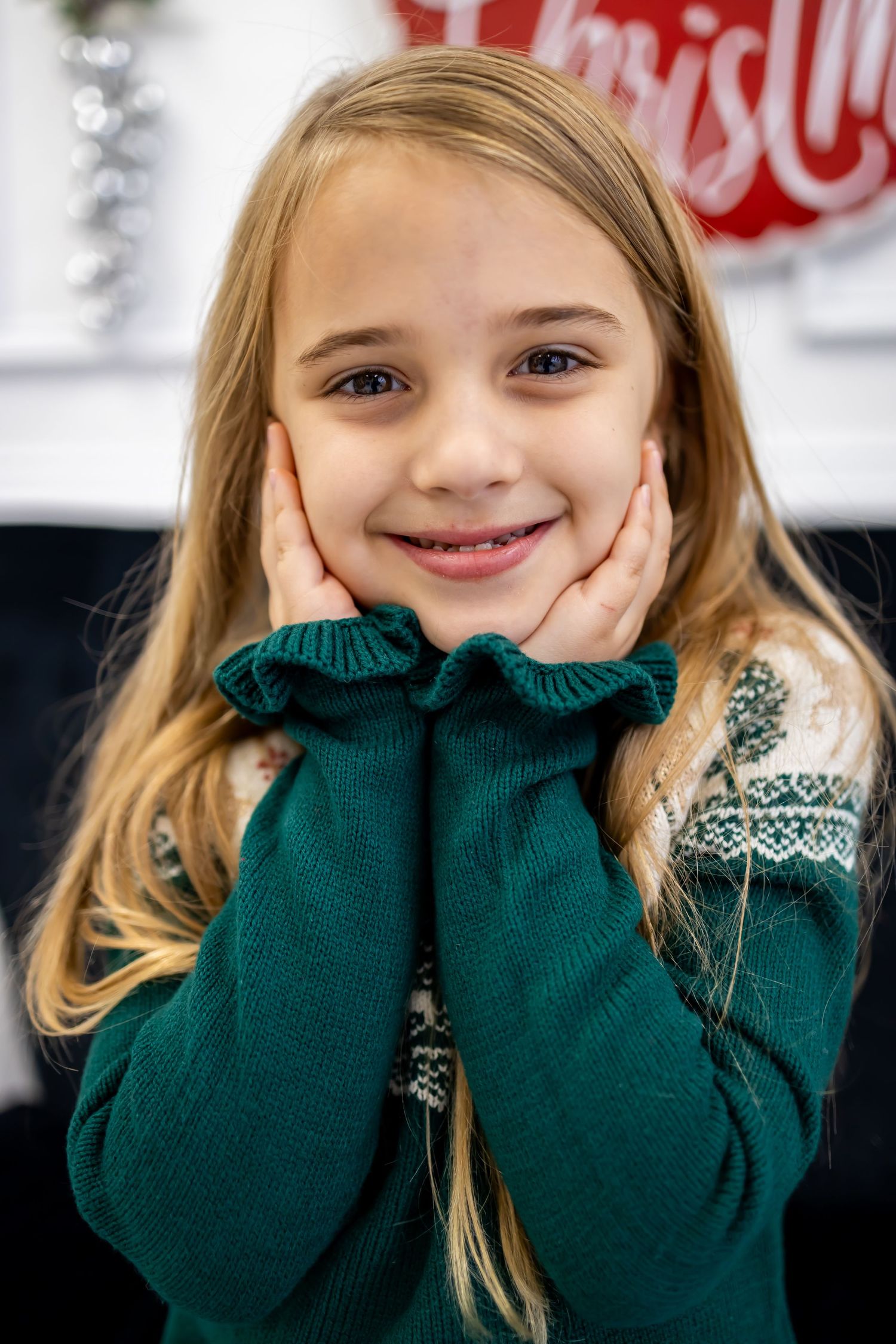 adorable little girl smiling for christmas photos