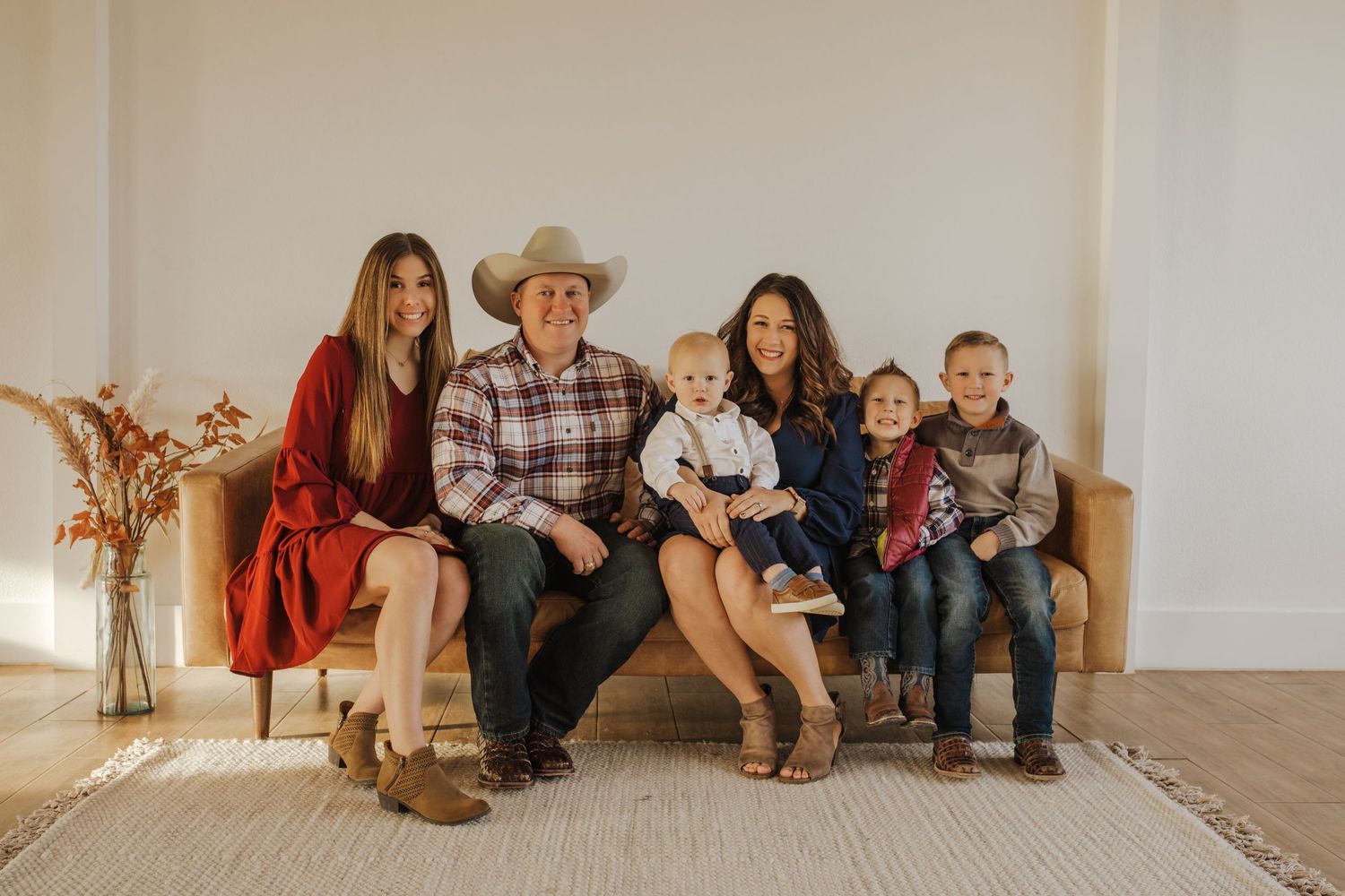 Family of six sitting on the couch in Waxahachie texas