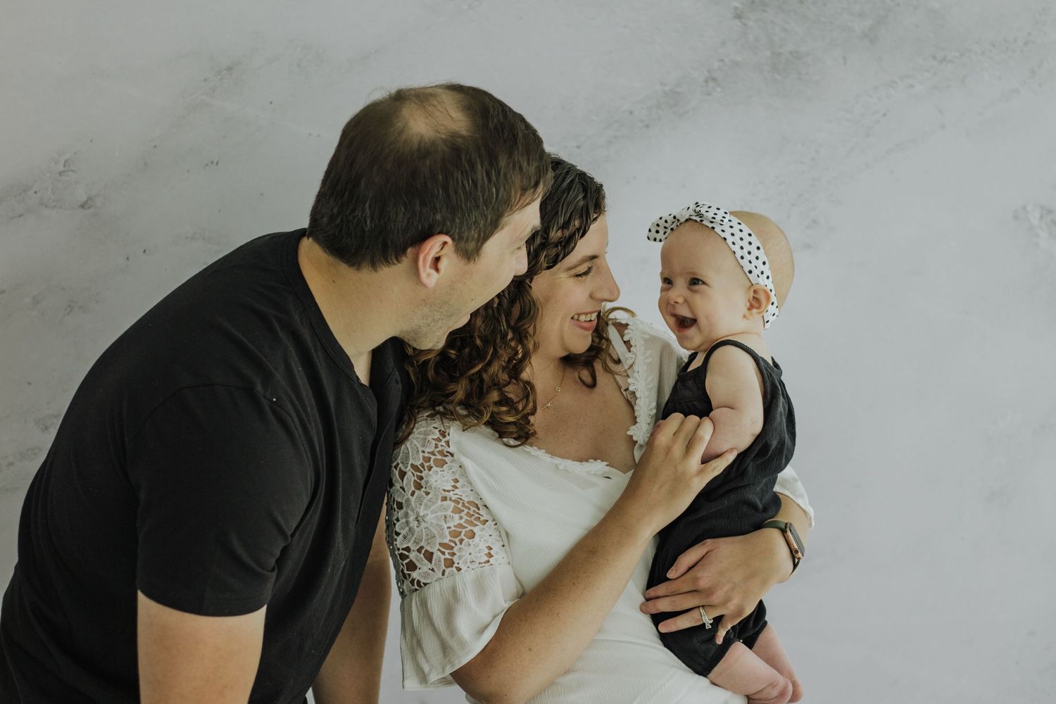 Family of three with six month old