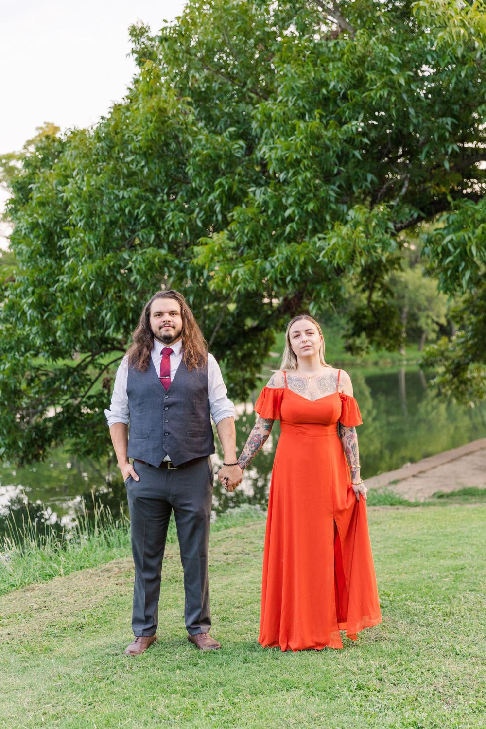 Couple posing by San Gabriel River in San Gabriel Park