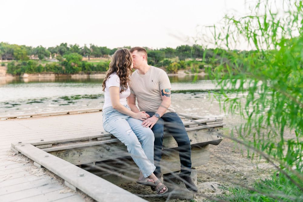 couple kissing on dock at Brushy Creek Lake