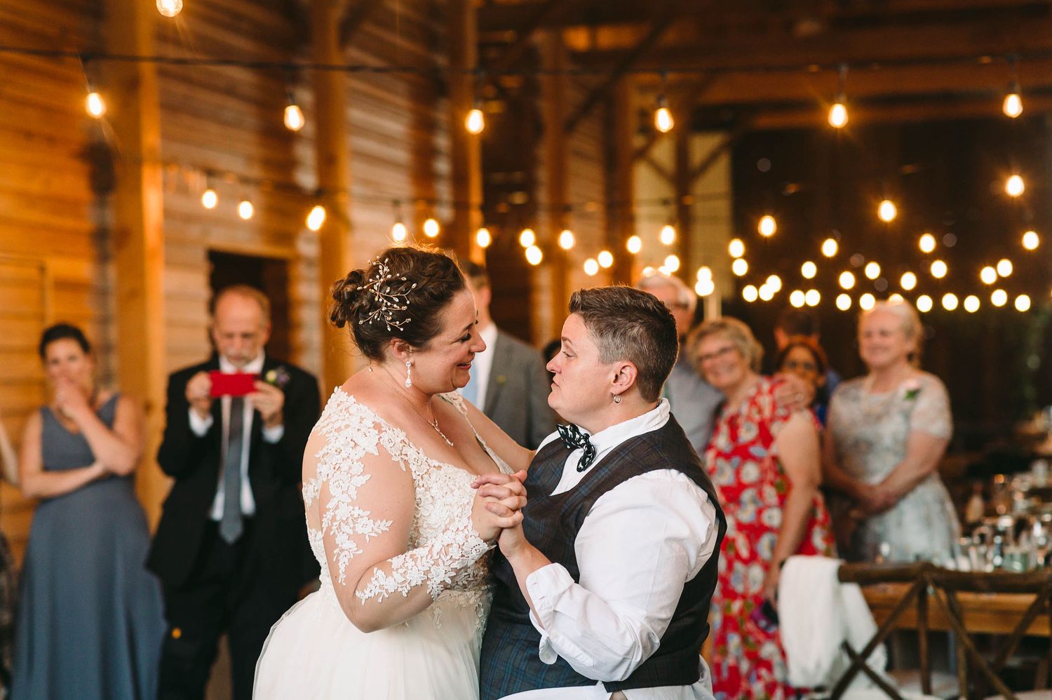 Lesbian Brides having their first dance at their wedding reception.
