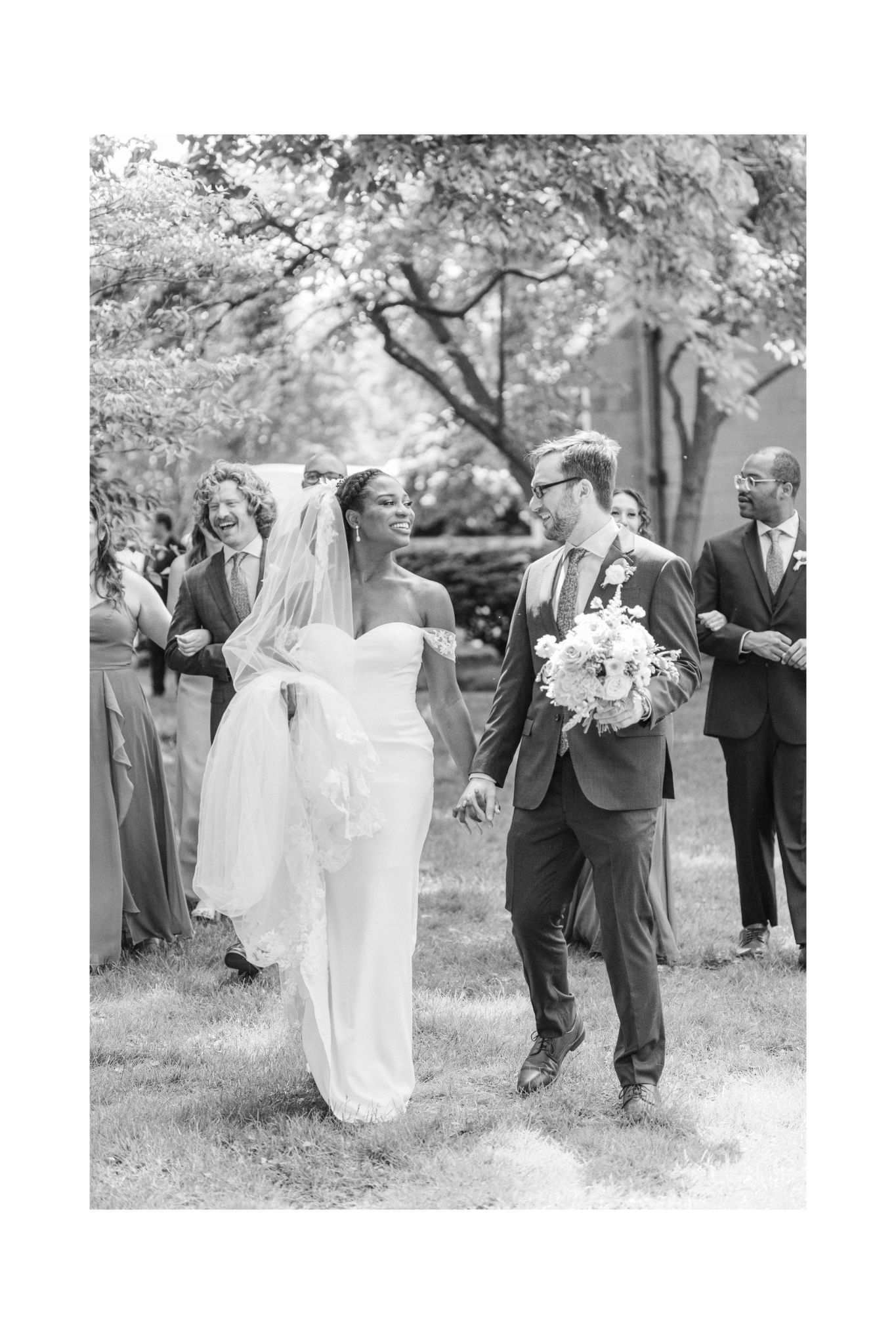 A joyful wedding ceremony moment captured in black and white.