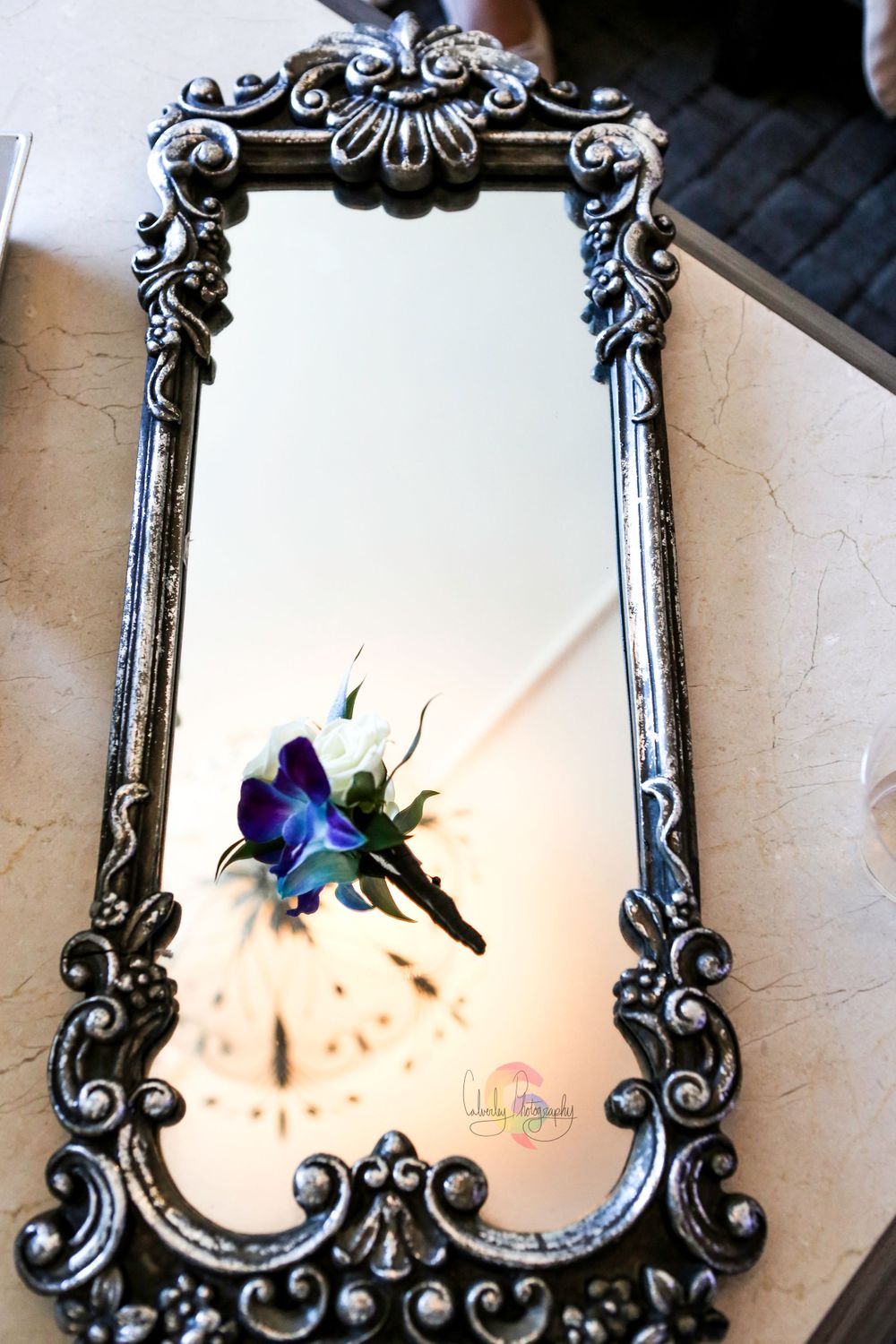 Boutonniere on Mirror Flatlay Wedding Photo
