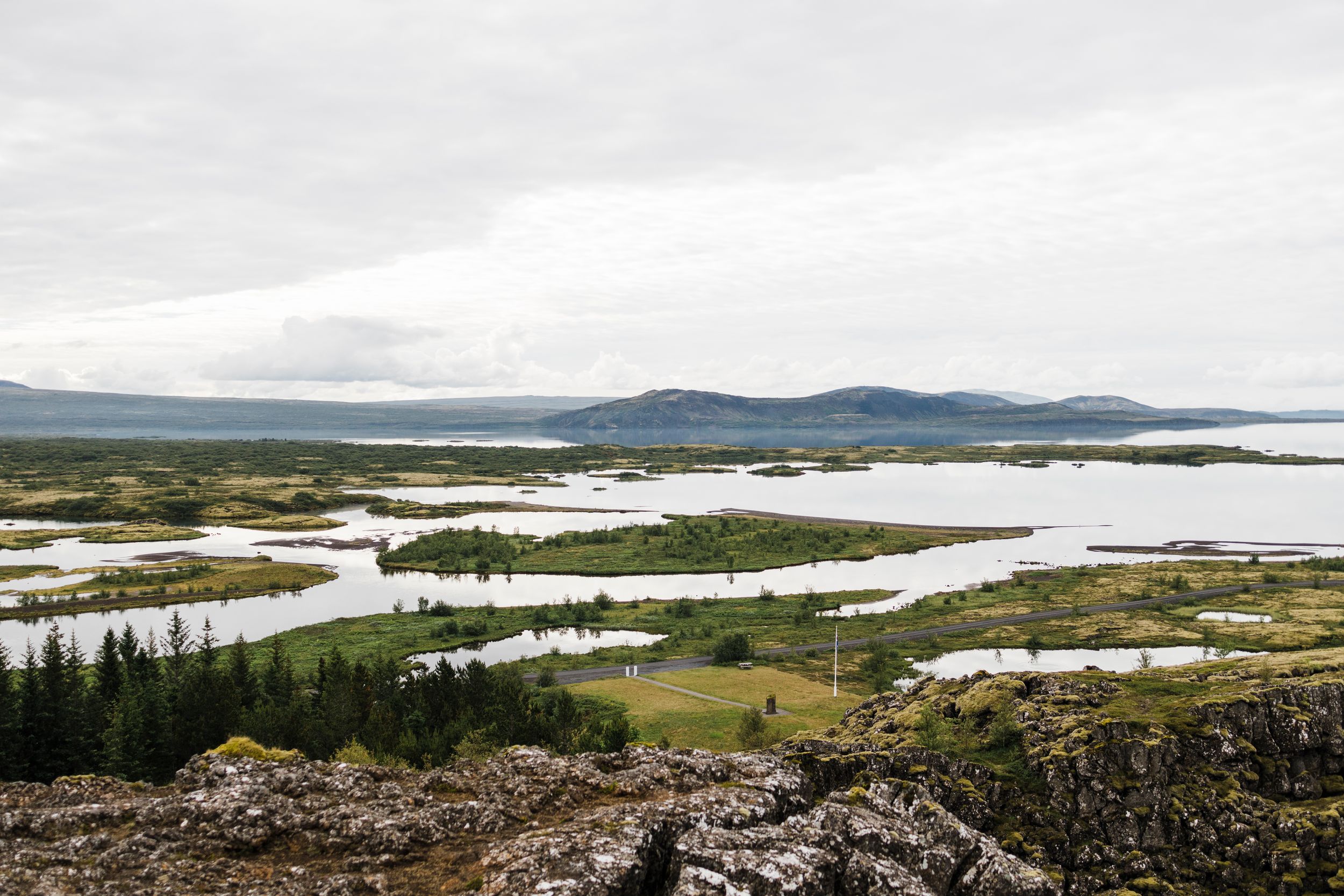 Scenic landscape view of islands and waterways in Nordic terrain under cloudy skies.