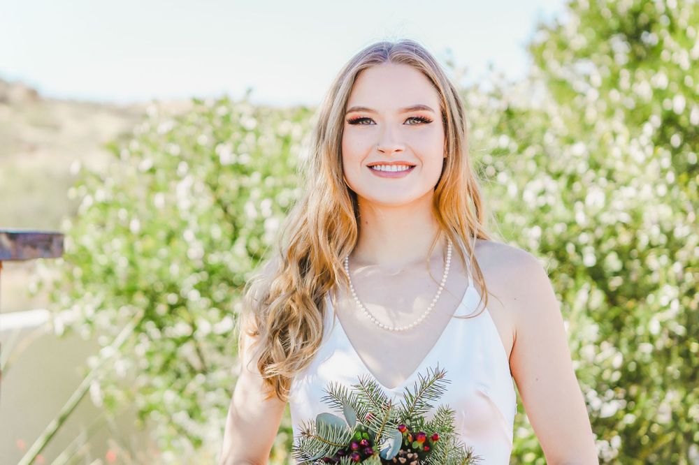 Portrait of a smiling bride with her bouquet