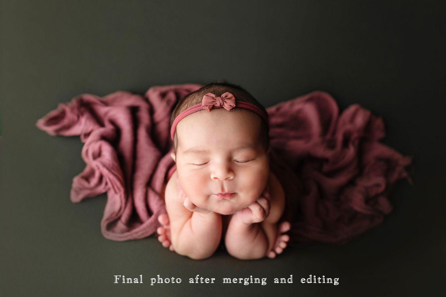 Sleeping newborn with hands under chin against dark burgundy fabric.