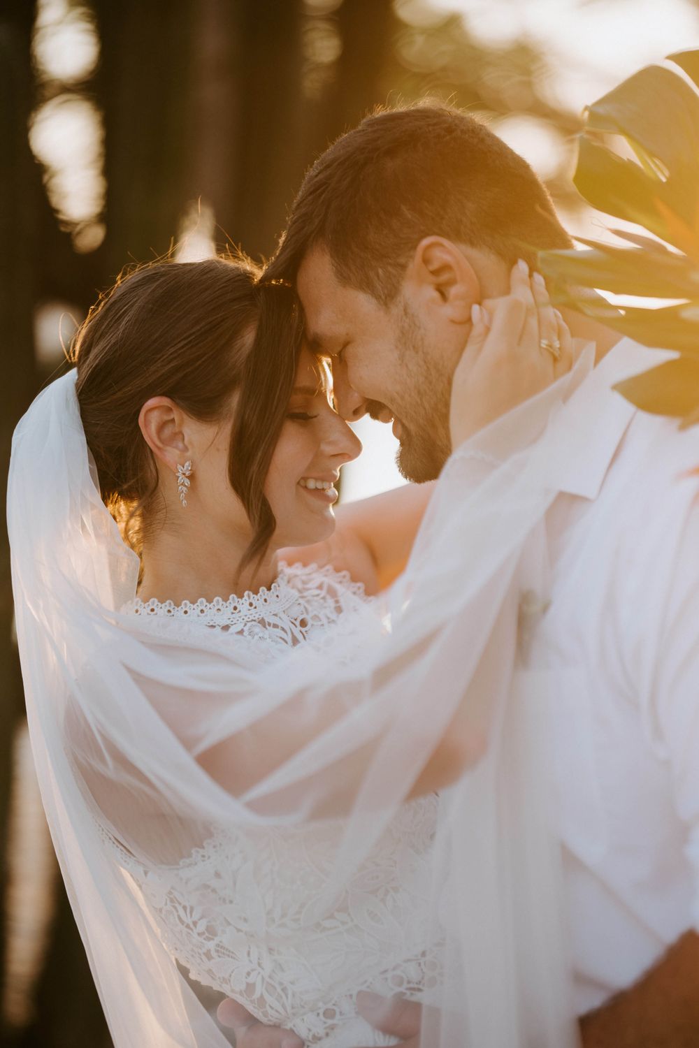 Couple embracing at sunset on a beach in Costa Rica