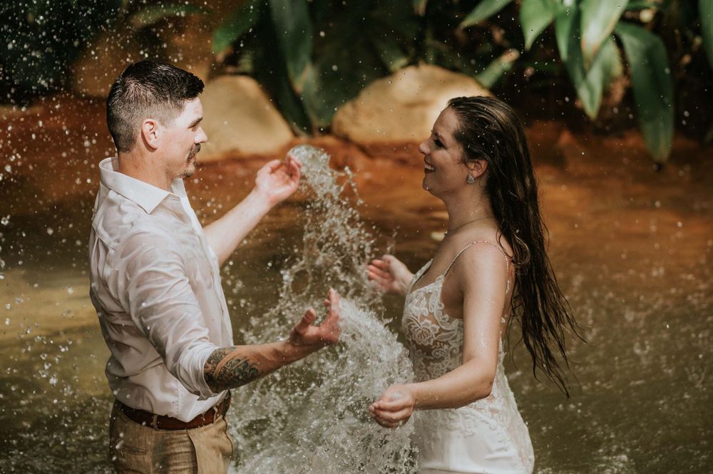 Wedding couple relaxing in hot springs after their ceremony in Costa Rica