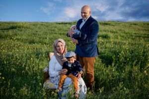 Sacramento portrait photographer - Family portrait in a field of wild mustard weeds in Sacramento, Calif.