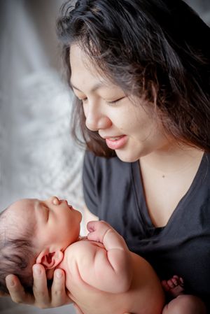 Sacramento portrait photography - portrait of a newborn with his mother.