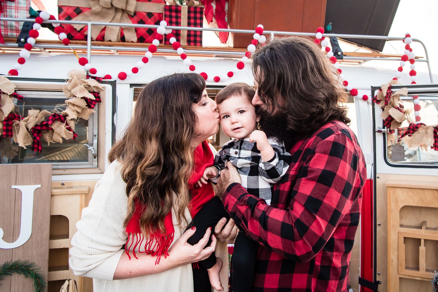 Image of a family with a VW bus decorated for Christmas in Orange County, CA