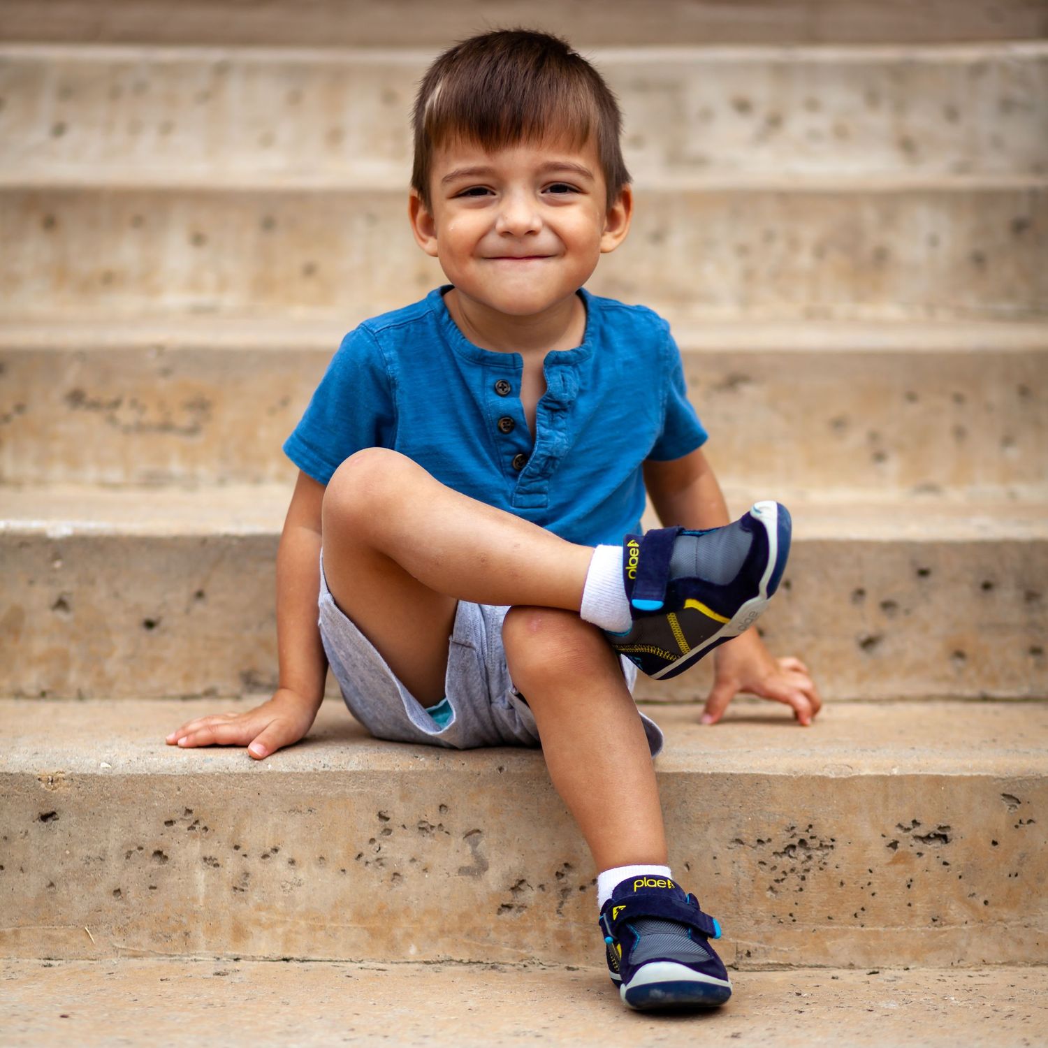 portrait of young boy on stairs in Carrollton, Texas