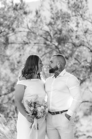 Series of candid black and white photos showing sweet family interactions outdoors.