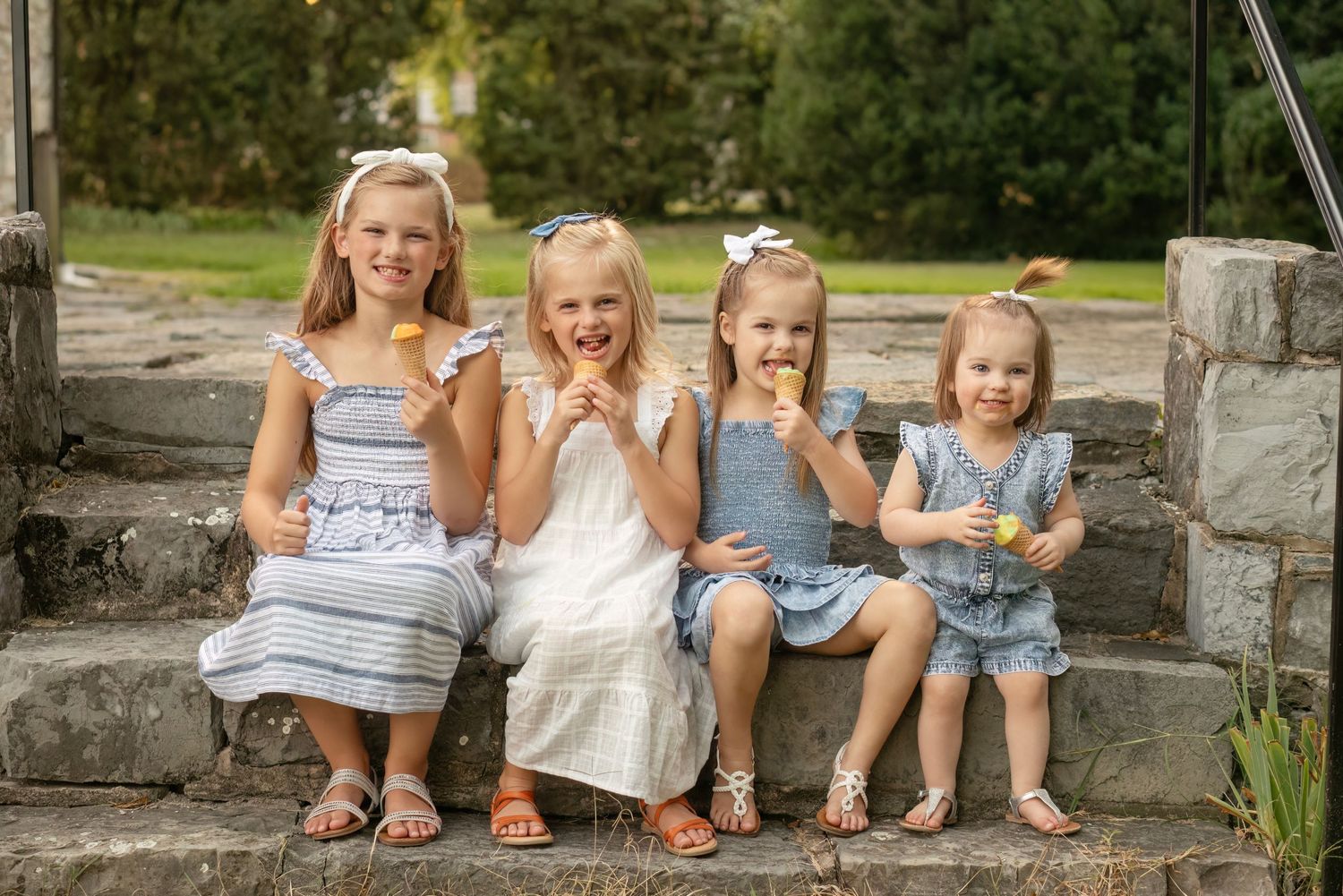 sisters enjoy ice cream cones during family photoshoot