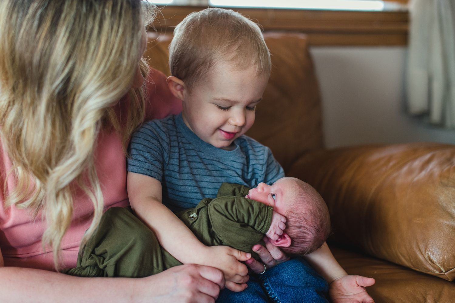 In-home lifestyle newborn family photo session by Wichita photographer