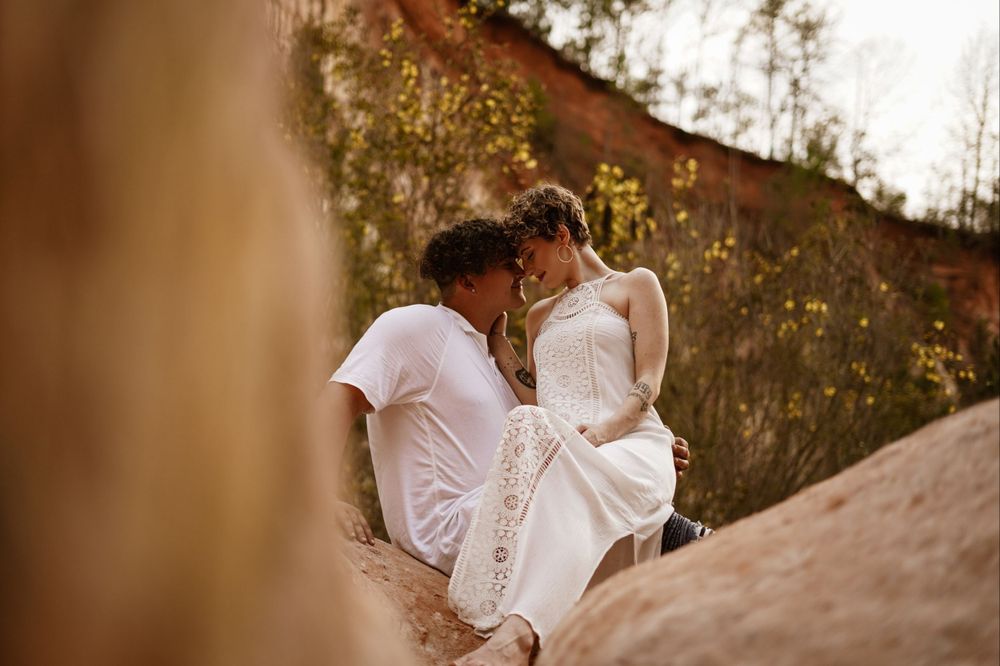 Destination, Elopement styled wedding in Cloudland Canyons in Georgia. Couple sitting together on the canyon intimately