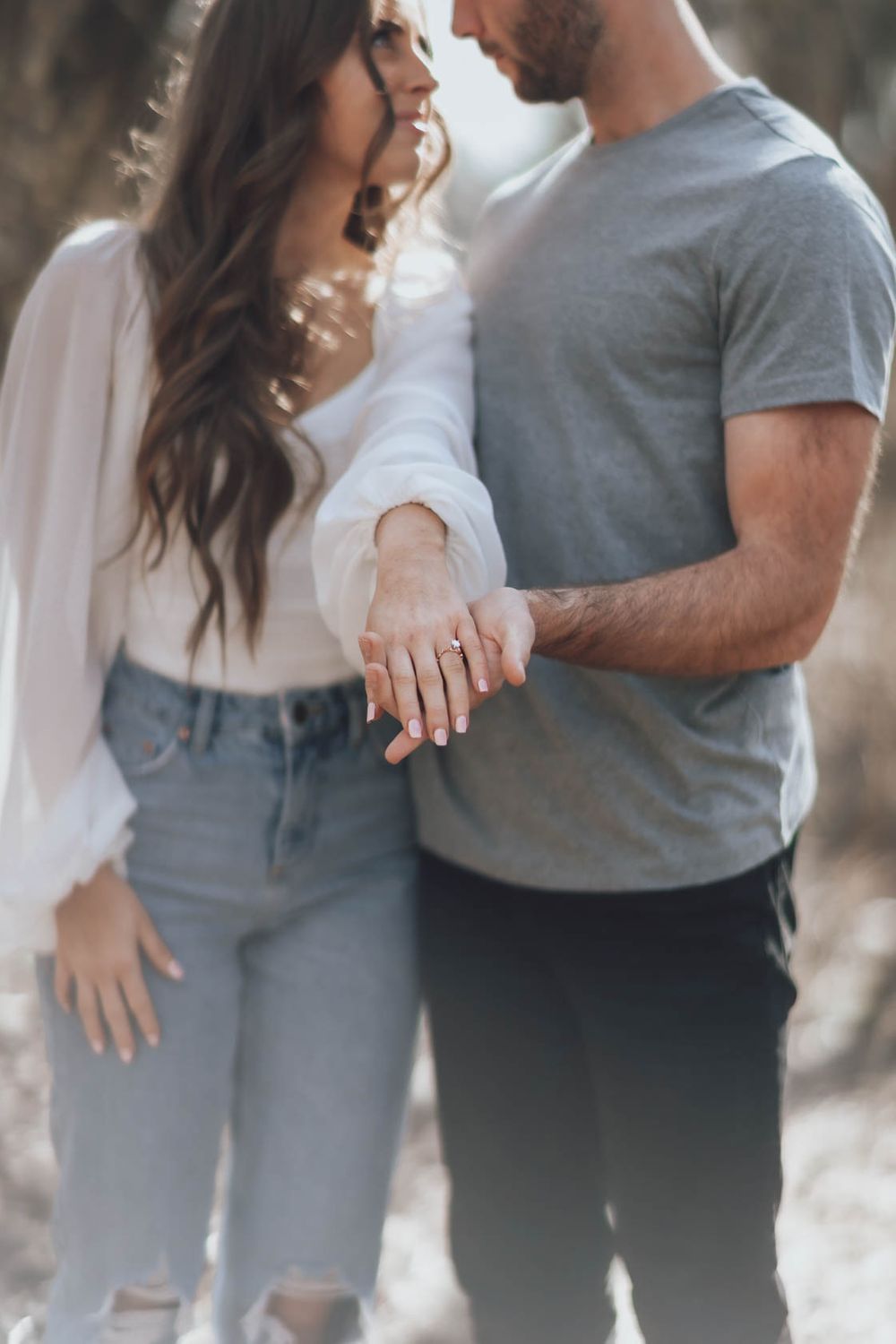 Close-up shots of couple in casual clothing showing affectionate moments outdoors.