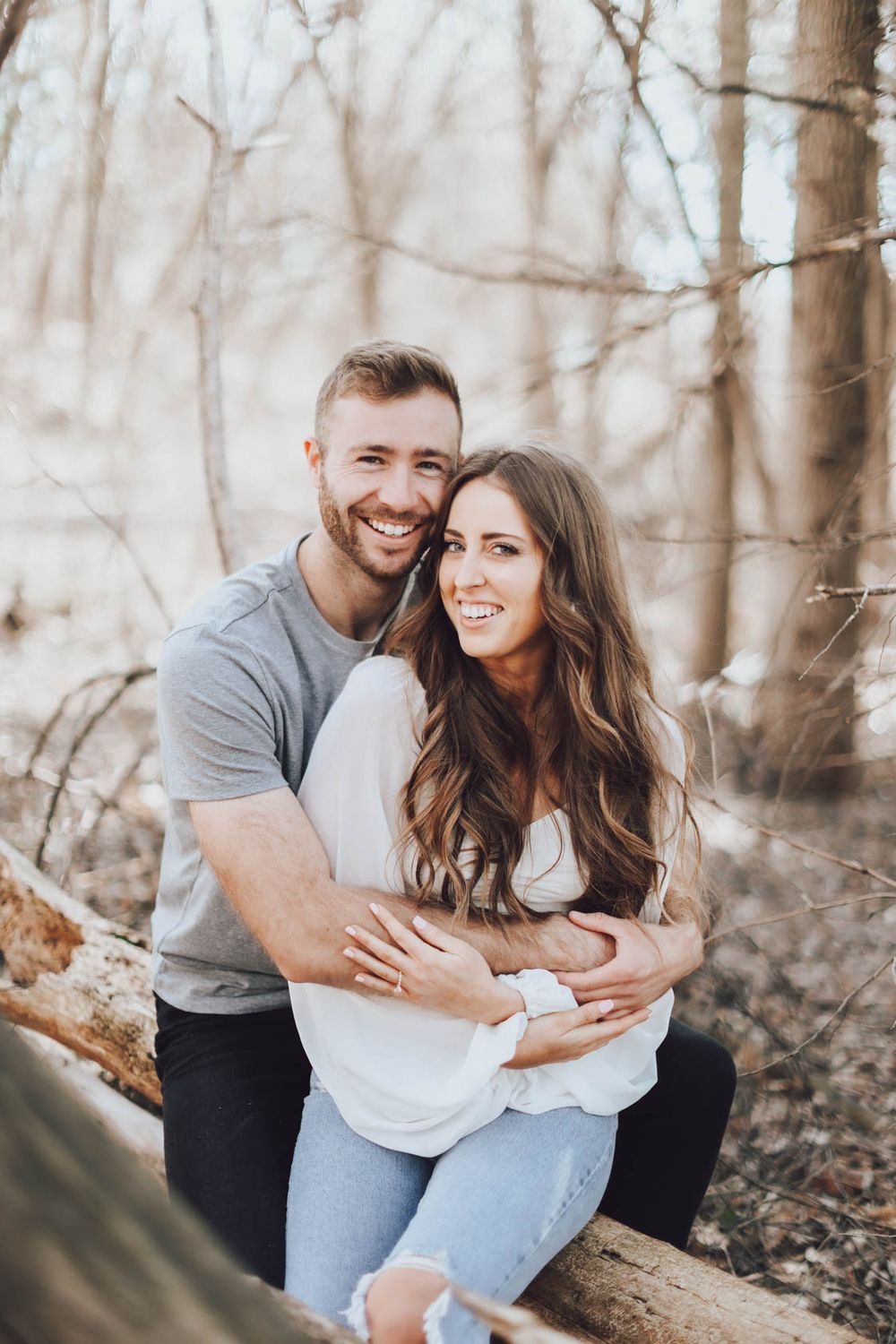 Candid moments of laughter and embraces between couple during outdoor photo session.