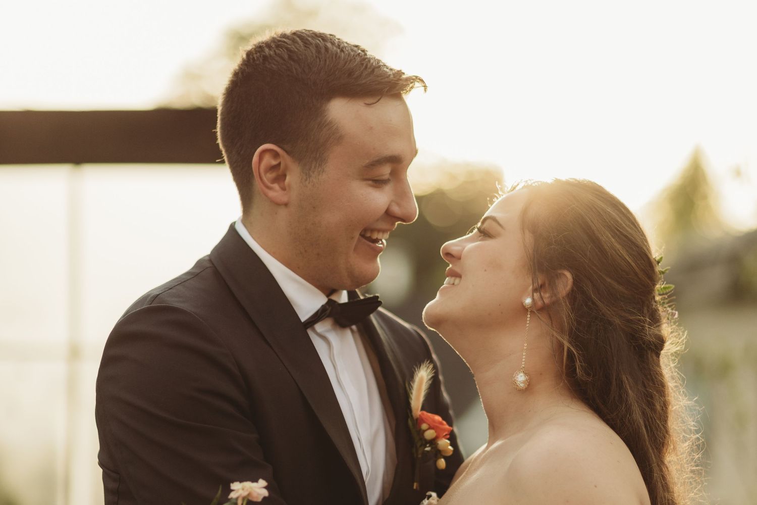Bride and groom romantic portrait during golden hour