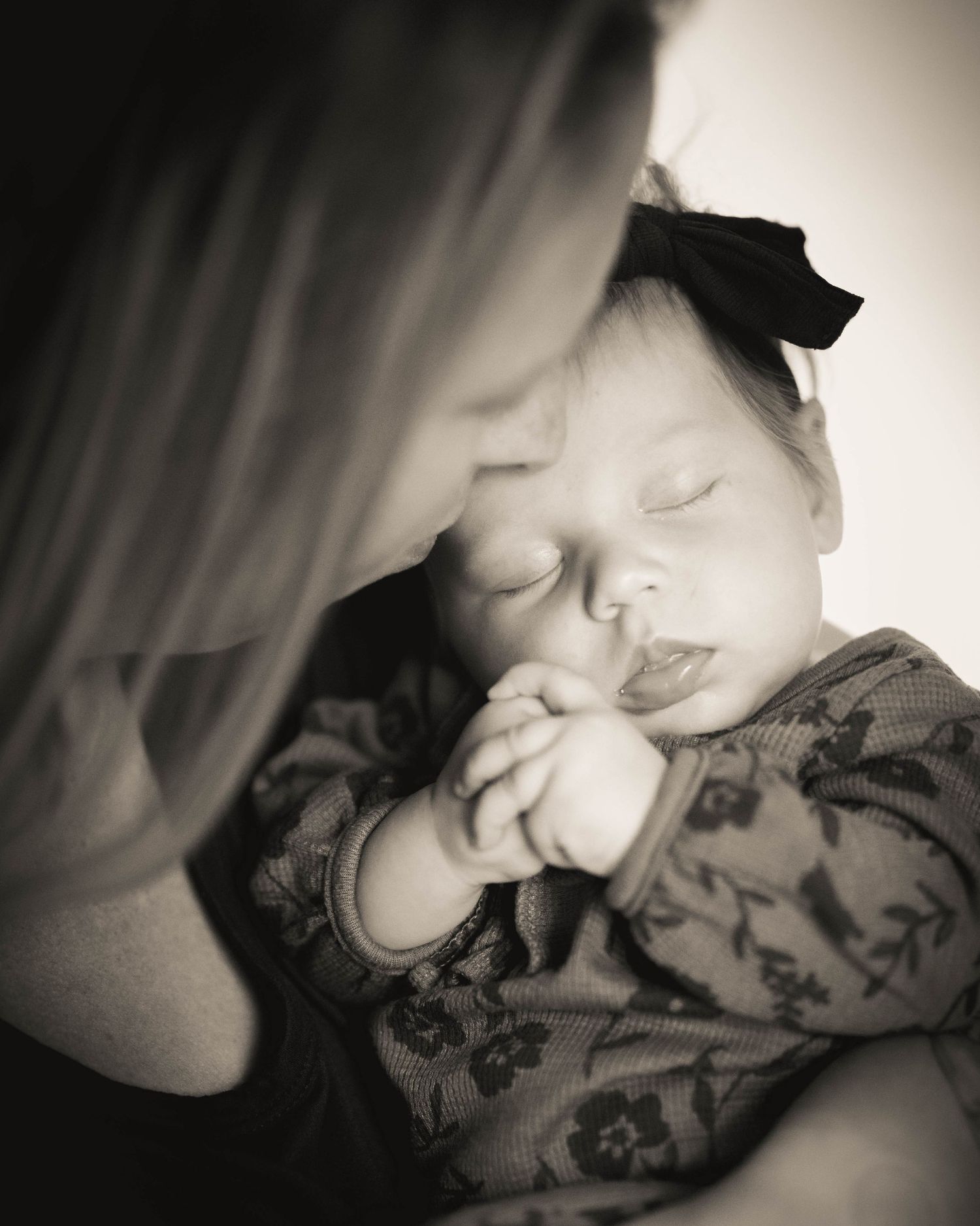 Mother and Infant Daughter in Black and White with Sepia Toning Taken in studio