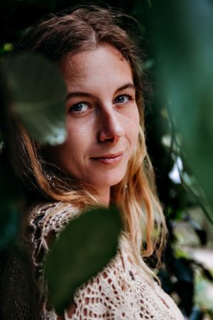 Portrait series showing warm expressions and crochet details against a blurred natural background.