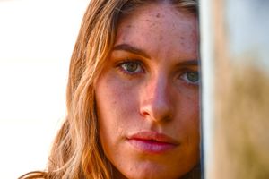 Warm-toned beauty portrait series with soft natural lighting.