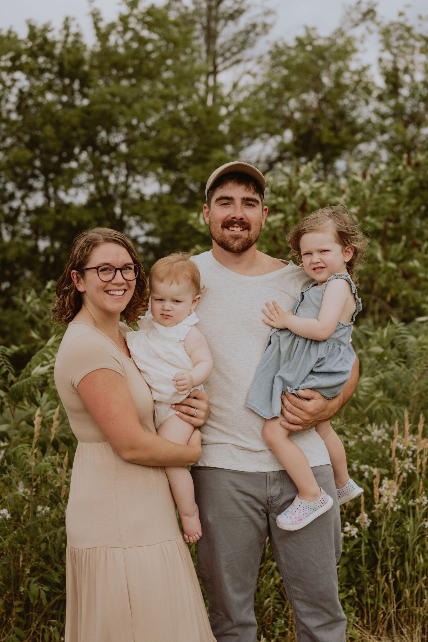 Image of family in front of trees.