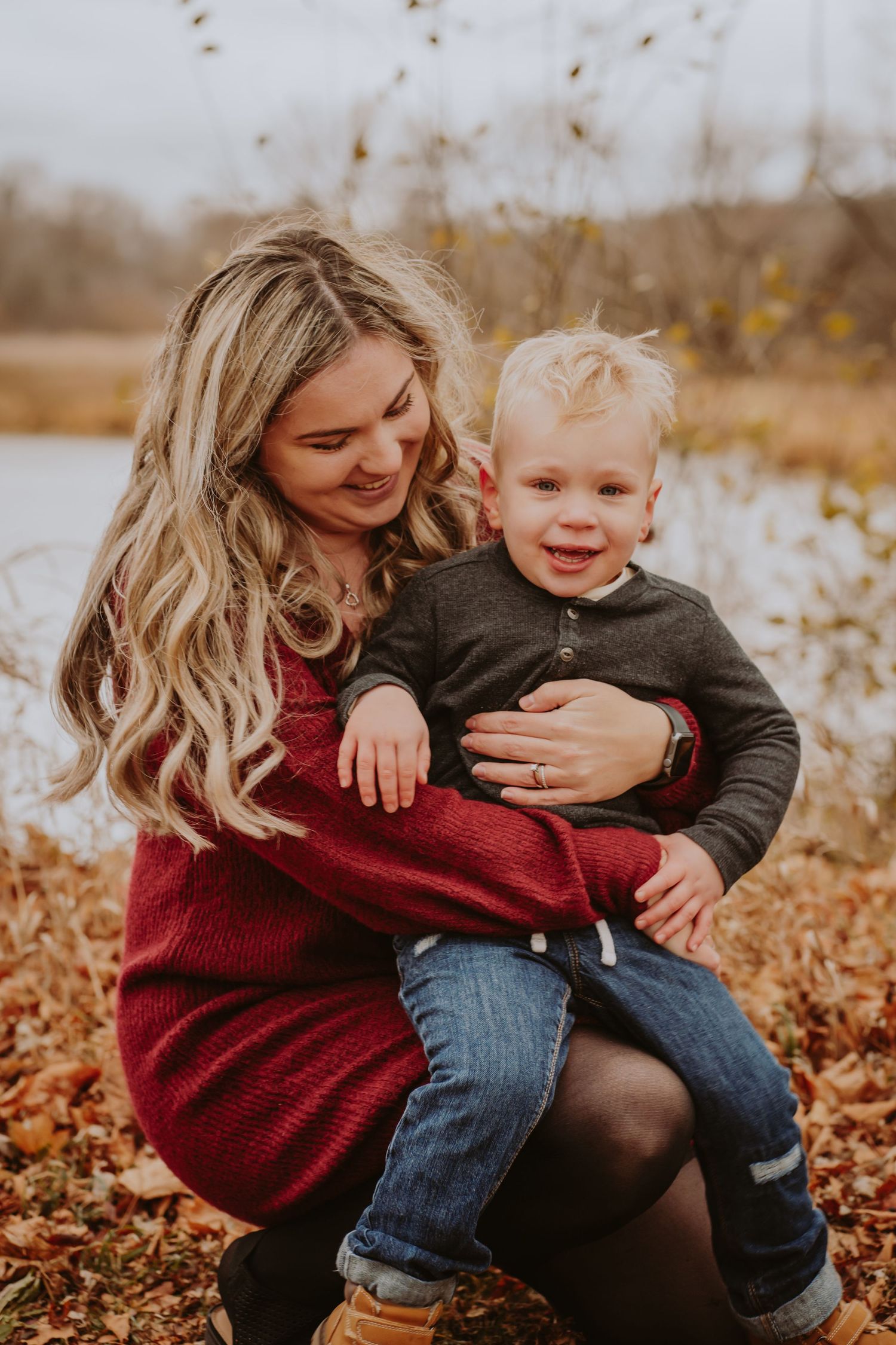 Image of mom and son in front of water.
