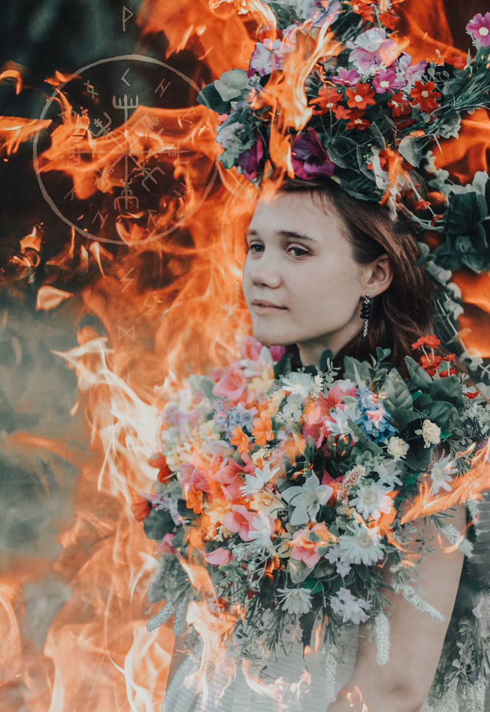 A mystical portrait with orange flames surrounding a person adorned in floral decorations.