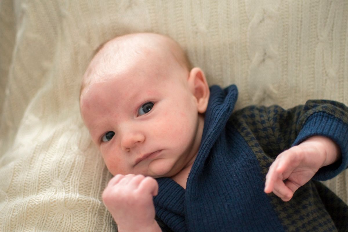 Baby looking at camera, seemingly ready to punch a right hook