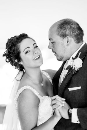 Black and white sequence of intimate wedding couple moments showing emotional expressions.