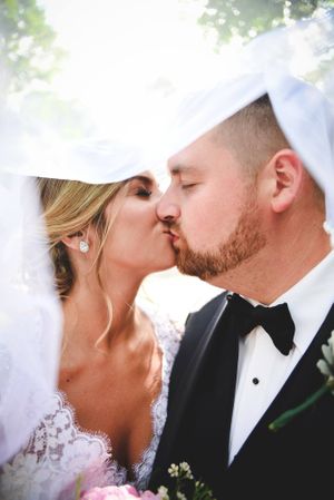 Series of romantic close-up wedding kisses under soft natural lighting and a white veil.