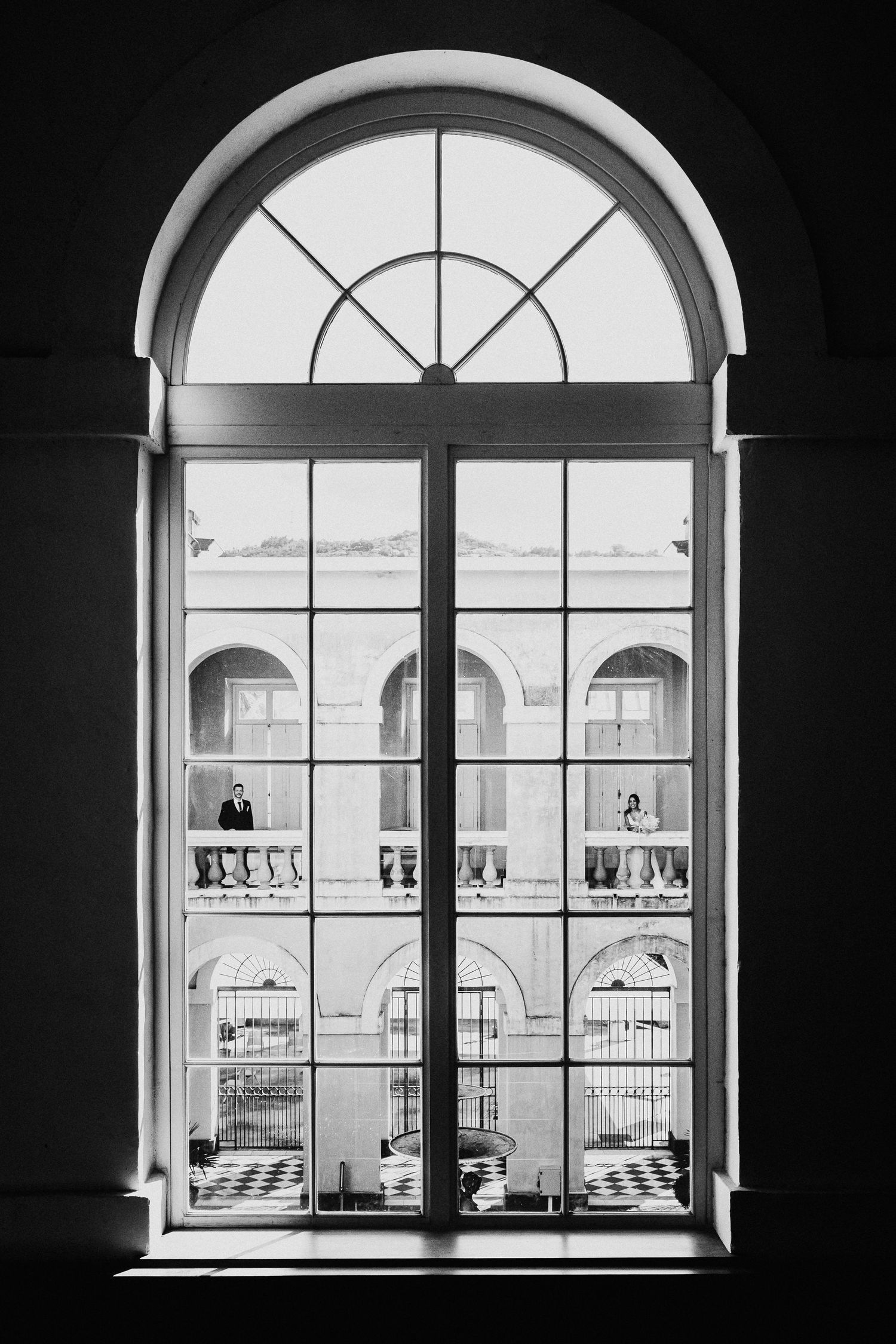 Series of arched windows in black and white photography showing architectural symmetry and natural light.