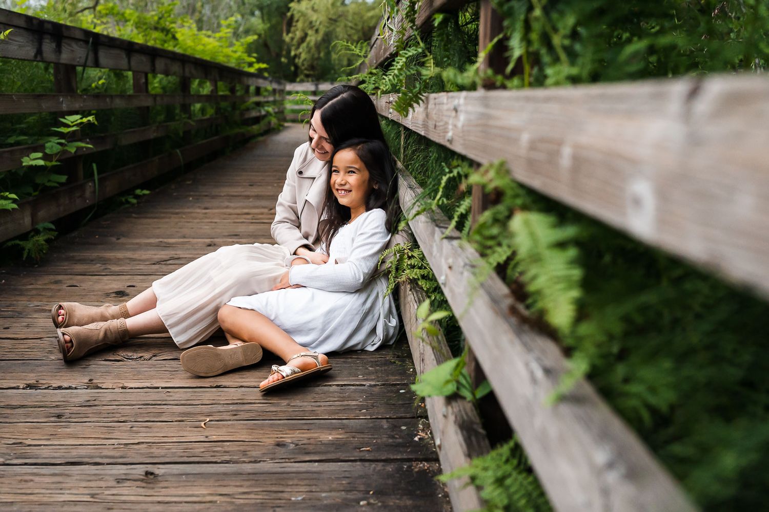 Mother daughter candid image on a boardwalk at Juanita Bay Park