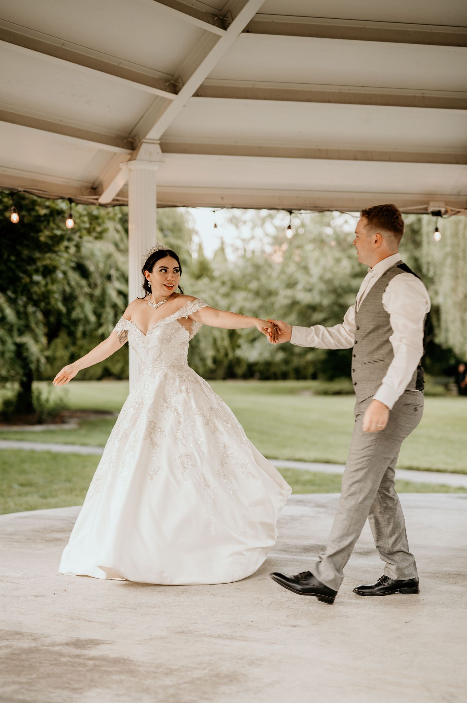 bride and groom first dance under the Promise Garden gazebo