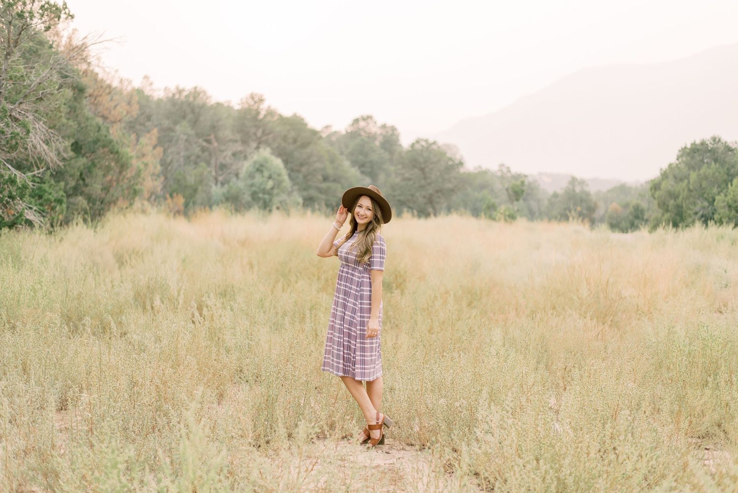 A natural and warm portrait of me, Rae, your photographer, capturing life’s special moments with heart and passion.